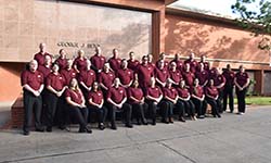 Image: Class #40 grouped in front of red brick building.